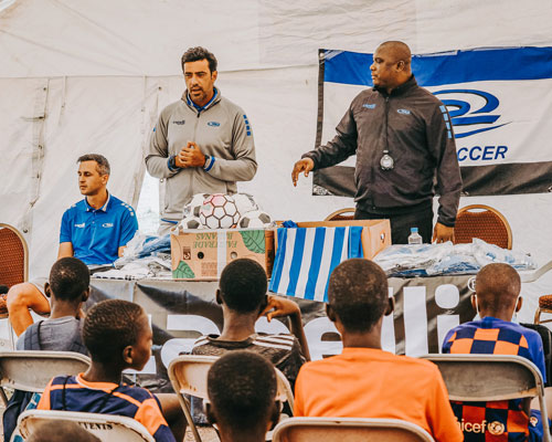 Rush staff talking to kids in Africa